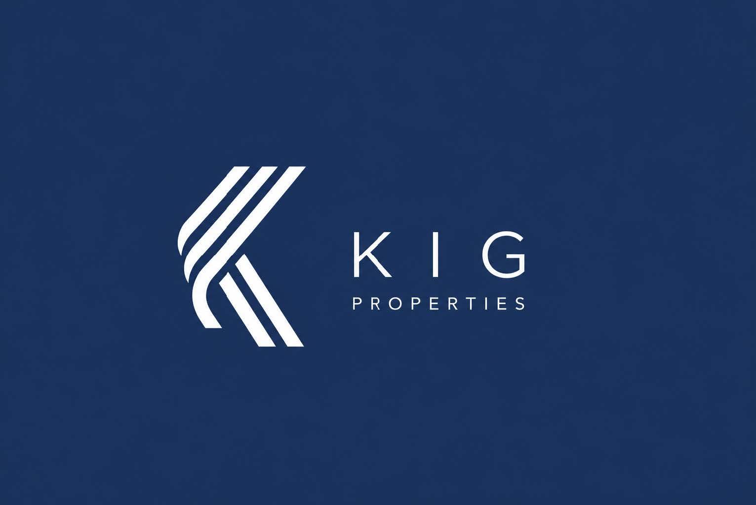 A logo with the text "KIG PROPERTIES" in front of a dark blue background.